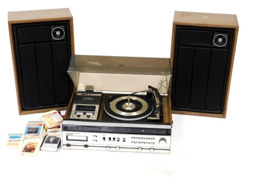 A Winthrop President stereo receiver, model 5996, with AM/FM, eight track tape player, cassette tape recorder, and automatic record changer, with instructions, together with a pair of wooden cased speakers, and various tapes.