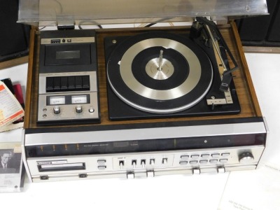 A Winthrop President stereo receiver, model 5996, with AM/FM, eight track tape player, cassette tape recorder, and automatic record changer, with instructions, together with a pair of wooden cased speakers, and various tapes. - 2