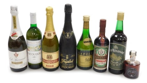 A group of alcohol, including a bottle of Napoleon VSOP brandy, Grant's Morello Cherry Brandy, Freixenet Cordon Negro Cava, and Asti Spumante Martini. (8)