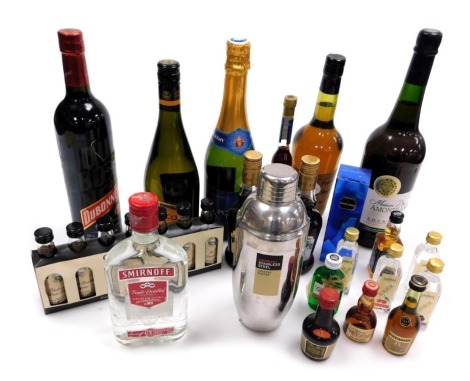 An assortment of liqueurs and spirits, a bottle of Poly Remy Gala Brut, assorted miniatures, Lyme Bay Winery Classic Minis, and a cocktail shaker. (a quantity)