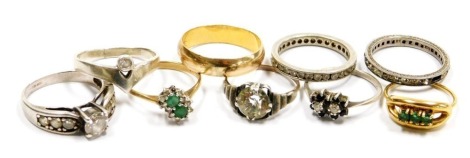 Nine dress rings, some gem set, including diamonds, in gold and silver, and unmarked metal.