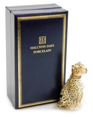 A Halcyon Days porcelain and silver gilt mounted scent bottle, modelled as a leopard, 8cm high, associated box.