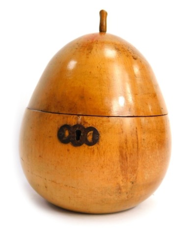 A Georgian treen fruitwood tea caddy, modelled as a pear with stalk finial, the hinged lid enclosing a vacant partially foiled interior, 17cm high.