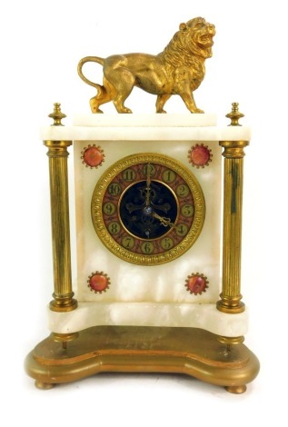 A 19thC Continental white marble and gilt metal mantel clock, with a painted Arabic numeral dial, key wind the case surmounted with a gilt cast metal lion, with reeded columns, on a gilt wood base, with key and pendulum, 36cm high overall.