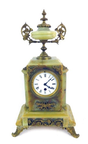 A 19thC green onyx and gilt ormolu mounted mantel clock, with an enamel Roman numeric dial, the case of architectural form, mounted by a two handled urn, raised on two front scroll cast feet, with key and pendulum, 46cm high.