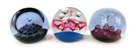 Three glass paperweights, comprising Caithness Atlantis, 269/1500, Mountains of Mars, 594/750, and Space Port, 71/1500. (3)