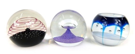 Three glass paperweights, comprising a Caithness Space Beacon, 488/500, Caithness Illusions, 406/1000, and Caithness Octet, 379/500. (3)