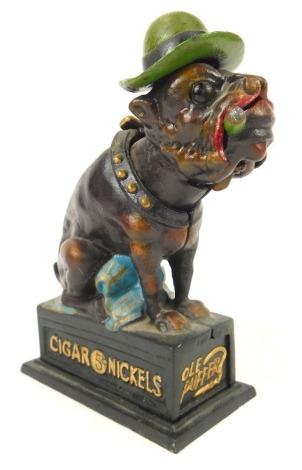 A reproduction Nicholls Cigar Old Puffer money box, formed as a dog, 21cm high.