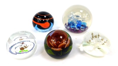 Five glass paperweights, comprising Caithness Robin and Kettle 217/1000, Selkirk Glass White Water Dust, Caithness Fragrance 197/250, Caithness Meteor 128/1000, and a large Selkirk Glass bubble dump 172/500. (5)