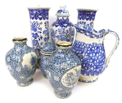 A group of blue and white pottery, to include a Villeroy and Boch ginger jar and cover, transfer decorated with reserves, woodland landscape against a multi-tonal blue prismatic background, 18.5cm high, together with two similar vases, a pair of Oriental