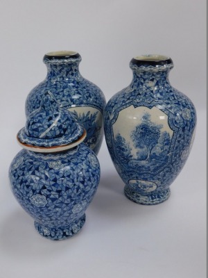 A group of blue and white pottery, to include a Villeroy and Boch ginger jar and cover, transfer decorated with reserves, woodland landscape against a multi-tonal blue prismatic background, 18.5cm high, together with two similar vases, a pair of Oriental - 3