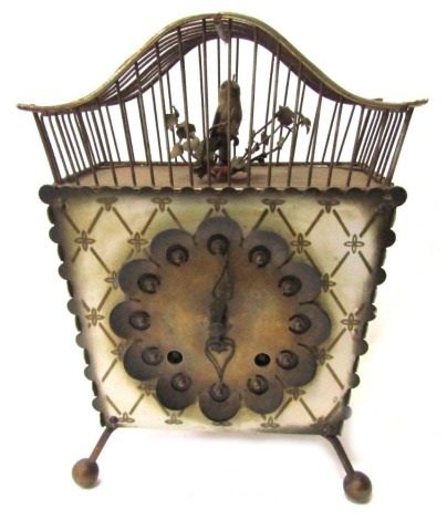 A 1950s/60s German bird cage mantel clock, with an arched and shaped top enclosing a bird perched and branch of berries, with a gilt and cross hatched panel and circular petalated central border, with movement stamped E Schmeckenbecher, 27cm high, 16cm wi