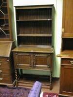 A barleytwist oak Dresser with open platerack over 2 cupboard doors