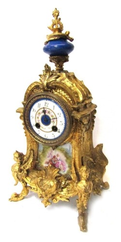 A 19thC French gilt metal mantel clock, with urn top, and a painted enamel  and blue