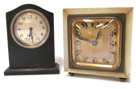 Two 1920s/30s miniature clocks, comprising an ebony and stainless steel cased timepiece, 9cm high, and a Heures Brevette marked white onyx mantel clock, with square numeric dial, 7.5cm x 7.5cm. (2)