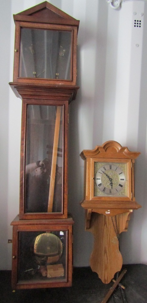 A Junghans oak cased wall clock with Roman numeric brass dial and