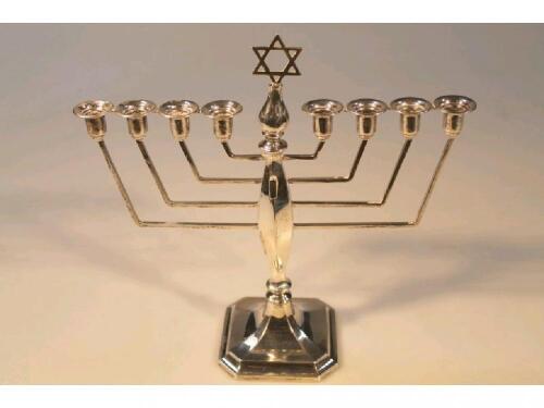 A mid 20thC silver Jewish Menorah candlestick by Alexander Smith