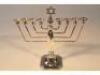 A mid 20thC silver Jewish Menorah candlestick by Alexander Smith