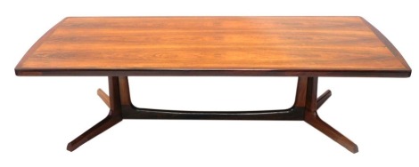 A mid to late 20thC Danish rosewood coffee table, the rectangular top with rounded ends, on trestle shaped base, 43cm high, 160cm wide, 70cm deep.