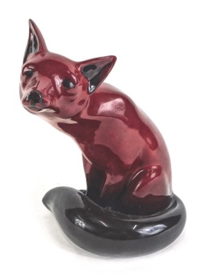 A Royal Doulton Flambe model of a seated fox, printed mark in black to underside, 24cm high.