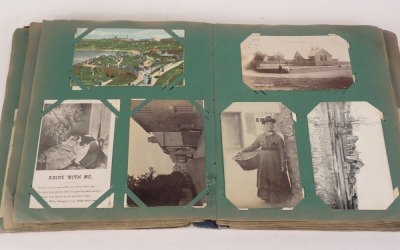 An album of early 20thC postcards, to include real photo, some comical, ships, First World War, etc. - 2