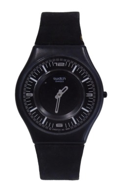 A Swatch watch, with black face and six dual movement, marked V8, with a numeric dial with silvered hands, on a suede bracelet, the watch head 3cm diameter.