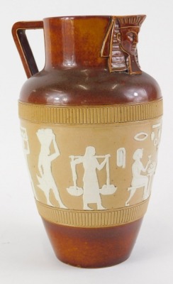 A Doulton Lambeth stoneware jug, decorated with a band of Egyptian figures, with angular handle and sphinx mask to spout, indistinct impressed mark to underside, 25cm high. - 2