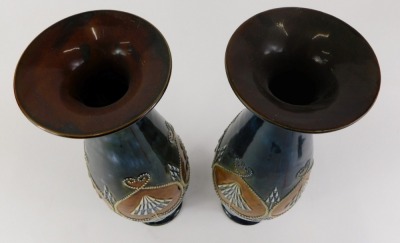 A near pair of Royal Doulton stoneware vases, each with a flared rim, the body with raised bead work decoration in stylised hearts, on a domed foot, impressed marks to underside and decorators initials limited edition PB and MH, possibly Marion Holbrook, - 2