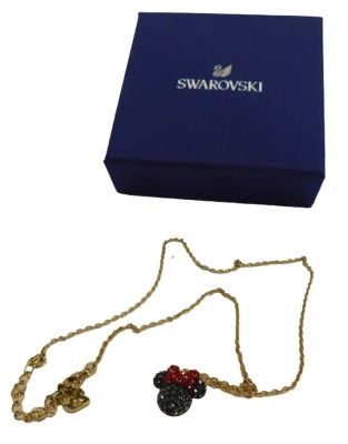 A Swarovski crystal Minnie Mouse pendant, on gold plated chain, the chain 42cm long, the pendant 1.5cm high, boxed.