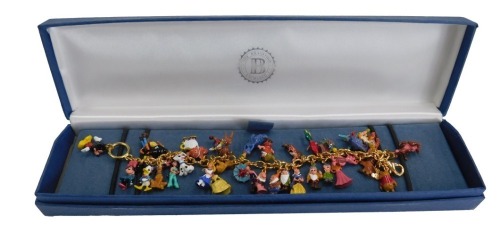 A Bradford Exchange Disney charm bracelet, with enamelled characters to include Winnie the Pooh and friends, Peter Pan and Tinkerbell, Snow White and The Seven Dwarfs, Cinderella, 101 Dalmations, Finding Nemo, Mickey and Minnie Mouse, etc., on a gold plat