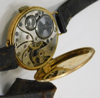 An 18ct gold cased wristwatch, with a circular painted numeric dial and seconds dial, with a fifteen jewel Swiss movement, with serial number 406672, London 1928, 2.5cm wide, on brown leather strap, 21.5g all in. - 3