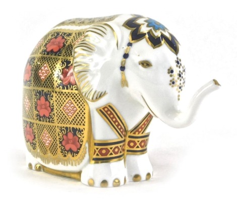 A Royal Crown Derby Imari elephant paperweight, with gold hexagonal stopper, 11cm high.