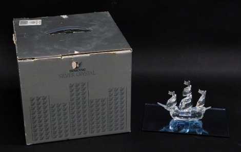 A Swarovski crystal ship, with stand, 11cm high. (boxed)