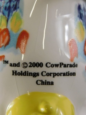 A Cow Parade ceramic figure of a cow, decorated with multi coloured design, and another similar. (2) - 2