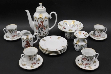 A USSR coffee service, to include coffee pot, 24cm high, footed comport, vase, plates, etc., decorated with card suites, with gilt highlights, marked beneath. (a quantity)