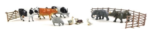 A collection of Britains and other lead animals, to include rhino, cows, elephant, and various fences, etc.