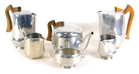 A Picquot ware aluminium and wooden tea set, and an extra milk jug. (6)