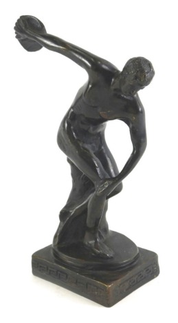 A late Grand Tour style bronze of a discus thrower, on a rectangular base, cast with Greek key design, 21cm high.