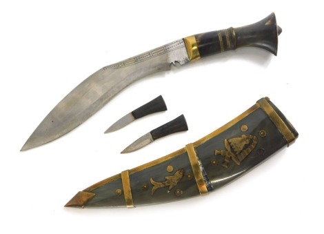 An ornamental horn and brass kukri, with two smaller daggers, 33cm long.