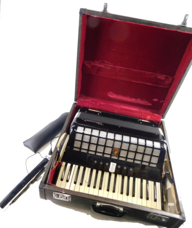 A mid 20thC Parrot 120 base piano accordion, in black trim with seven buttons, 44cm wide, in outer case.