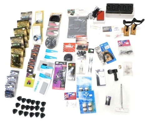 A quantity of Stagg Kinsman and other guitar accessories, to include a cable clamp, a latching foot switch, Wedgie guitar pick, etc.