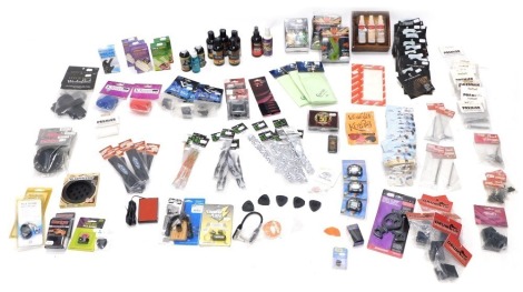 Various guitar accessories, to include polishing cloths, a Kyser instrument care kit, etc.