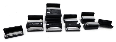 Various Global Planet Planetone Super Steel harmonicas, various pitches.