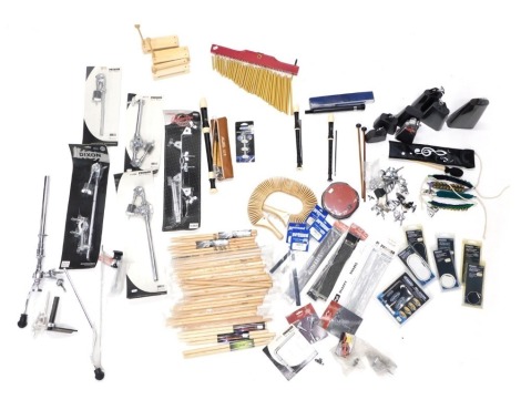 A quantity of percussion instruments, accessories, stands, clamps, cowbell, drum sticks, etc. (2 boxes)