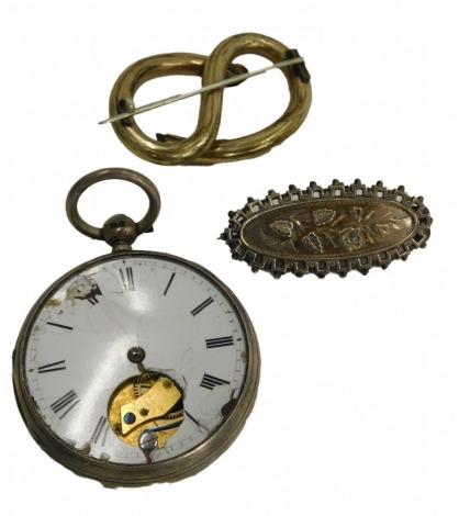 Three items of jewellery, comprising a silver pocket watch case, with partial dial, (AF), 82.4g all in, a silver bar brooch with flower design, 3.7g, and a plated rope twist bar brooch. (3)