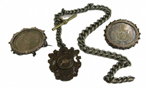 Two silver coin brooches, comprising an 1896 shilling and 1859 1000 mark, in silver frame, a silver shield fob inscribed RSA, on a plated watch chain, 47.4g all in. (3)