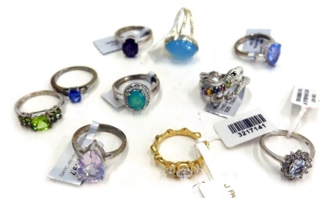 A collection of silver and other dress rings, comprising nine silver dress rings, each stone set, and a silver gilt and stone set dress ring, 37g all in.