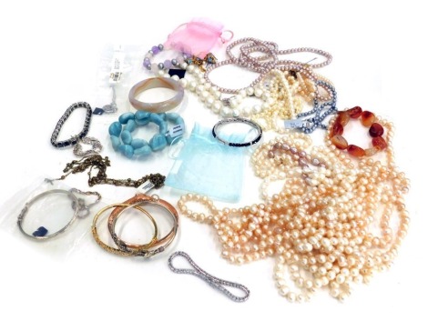 A group of Gemporia and TJC jewellery, to include silver and plated bangles, faux pearl necklaces, cultured pearl necklaces, hard stone bangles, etc. (1 tray)