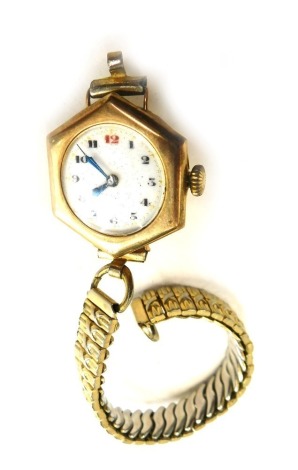 A 9ct gold cased wristwatch, with hexagonal clock face and seventeen jewel movement, with white enamel numeric dial, on a plated and expanding stainless steel strap, 19.5g all in.