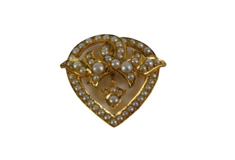 A heart shaped seed pearl pendant/brooch, in heart shaped design set with seed pearls, in a yellow metal setting, marked 15ct 10693, with pendant clip and two screw holes possibly for a brooch fitting, 2.5cm x 3cm, 4.5g all in.